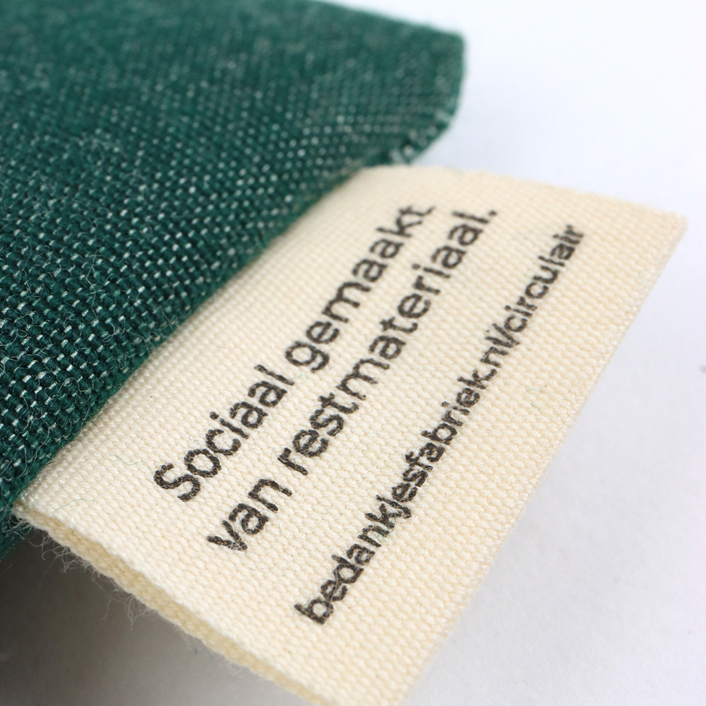 Zaden in impact zakje - Detailfoto label sociaal gemaakt